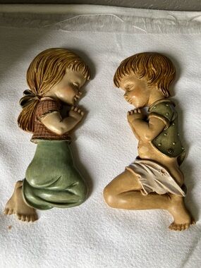 vintage chalkware wall plaques from the mid-century era feature a praying kids
